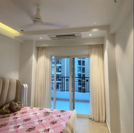 Home bedroom with custom curtains by RJO Enterprises